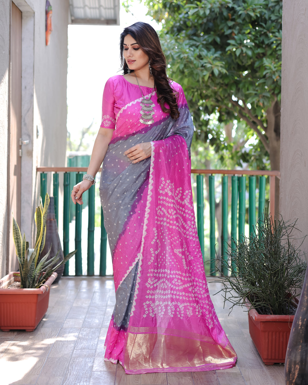 Hot-Pink Bandhej Silk Drapes with Zari Tissue Pallu, offering a vibrant and luxurious style for USA customers.