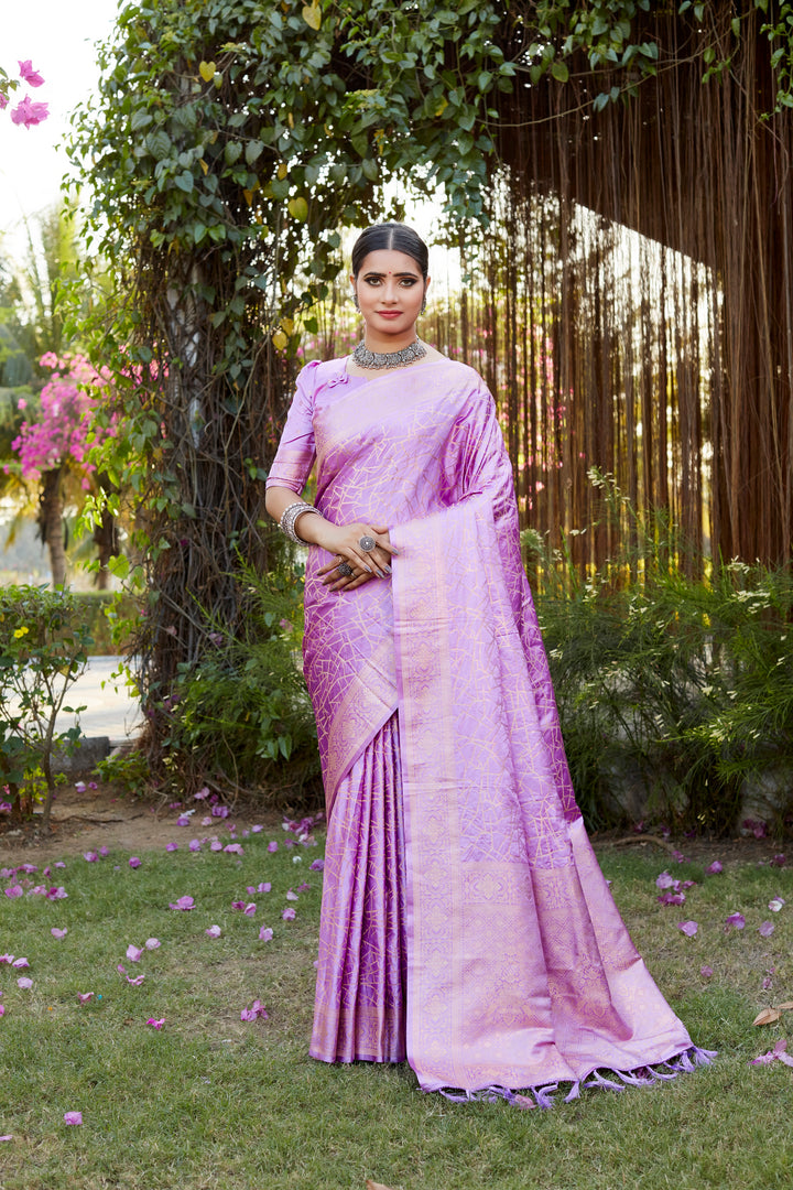 Elegant pink Kanjivaram soft satin silk saree with intricate weaving and butta design, ideal for festive wear.