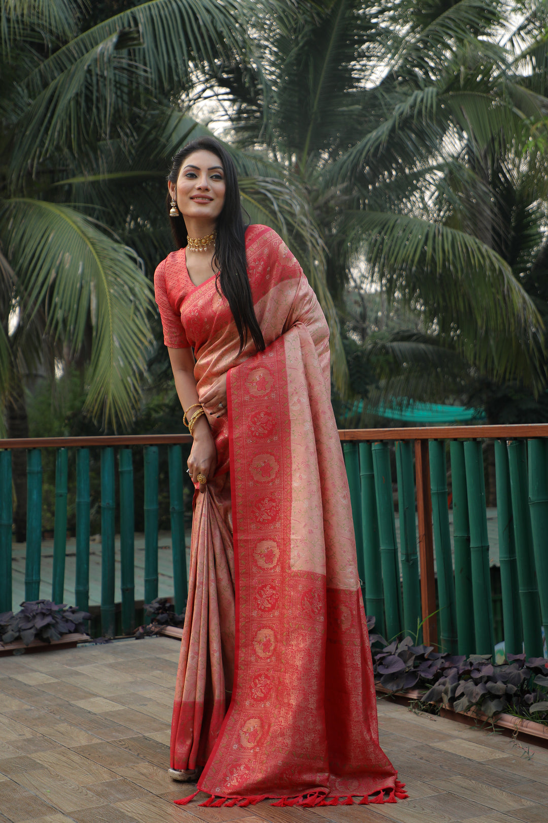 Graceful peach Kanjivaram silk saree with a beautifully woven border and intricate craftsmanship, ideal for weddings.