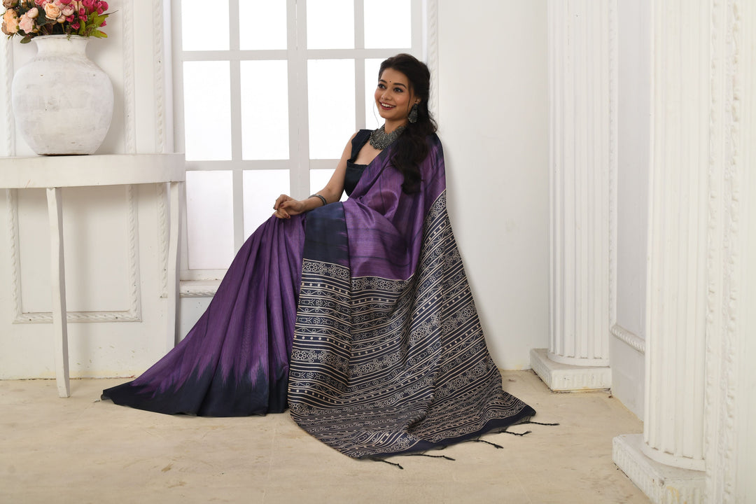 Graceful Tussar silk saree with a printed temple border and traditional fabric pattern for special celebrations.