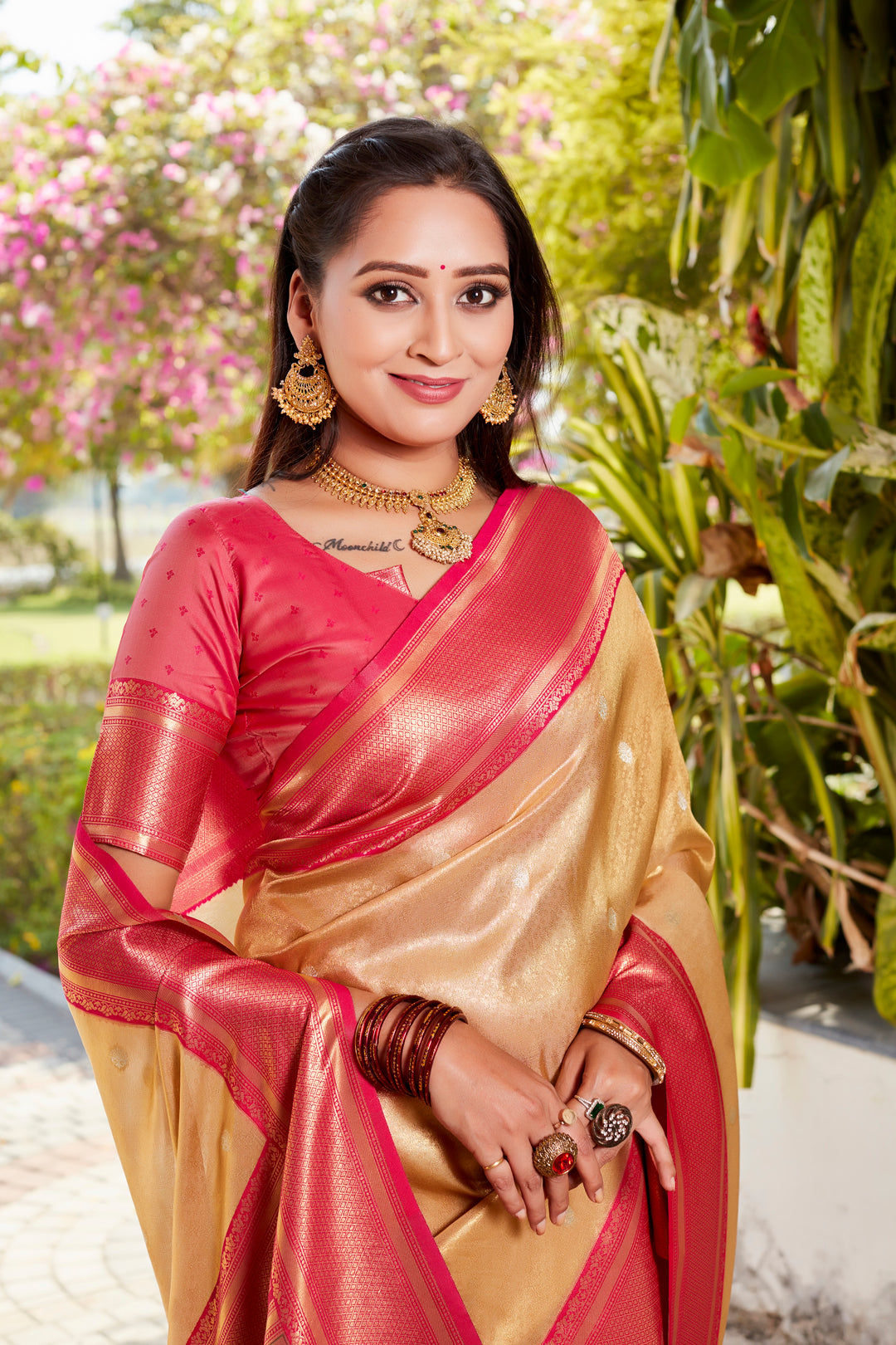 Elegant beige tissue silk saree featuring a rich pallu and contrast blouse, perfect for festive wear.