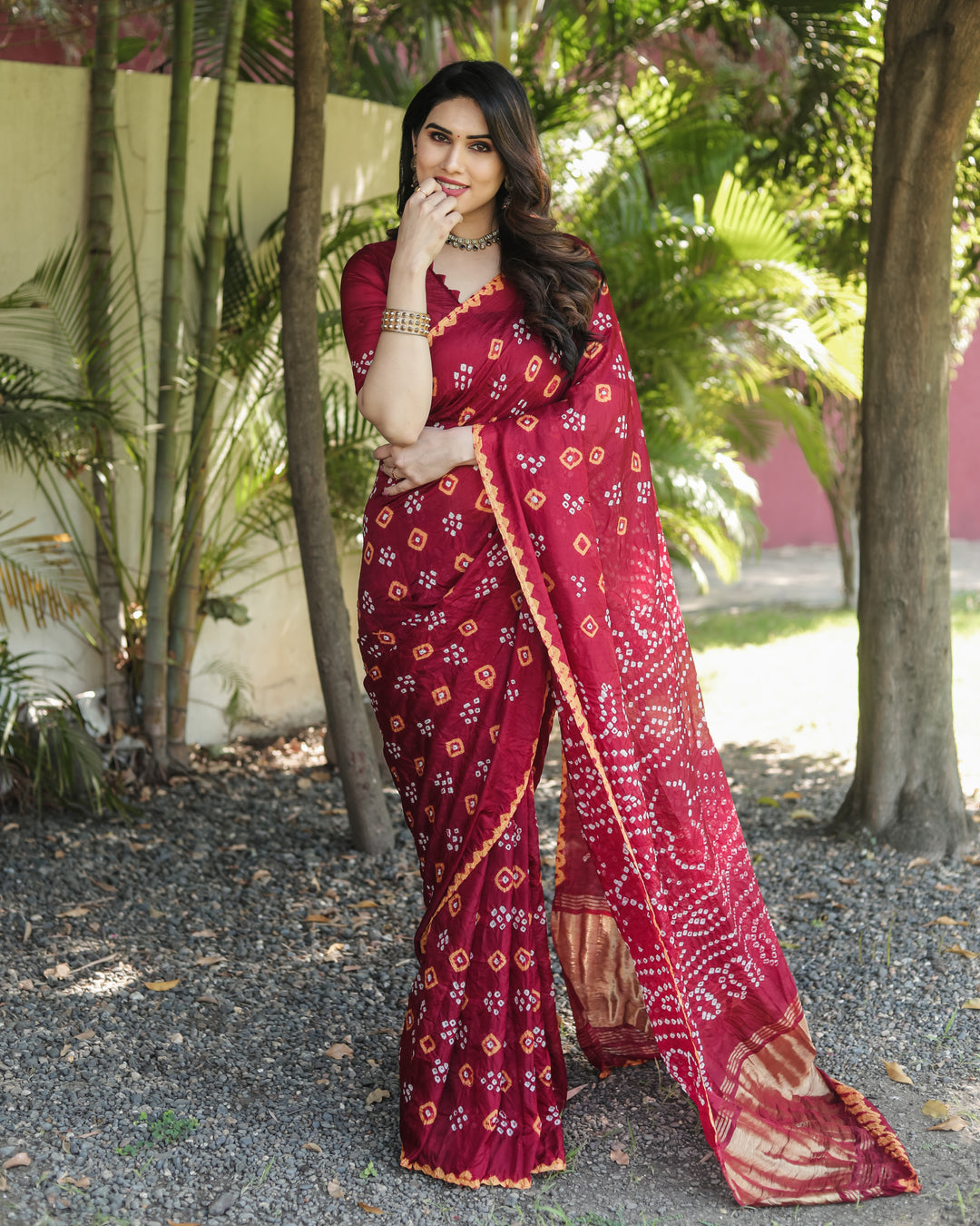 Luxury Bandhej silk saree with delicate tissue pallu and elegant zari weaving details.