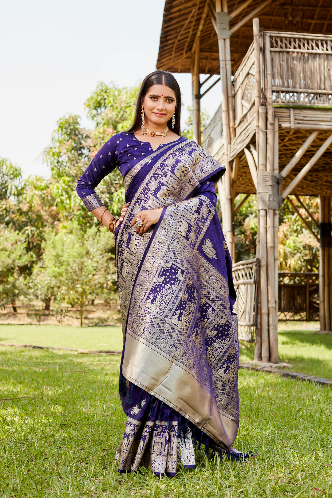 Exquisite wine satin Kanjivaram saree featuring a vibrant elephant border design, perfect for traditional celebrations.