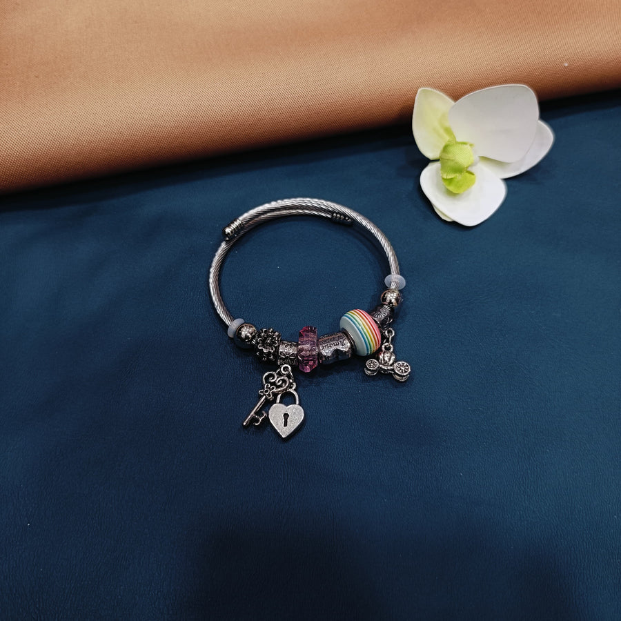 Chic Pandora bracelet with a blend of silver and gold charms, suitable for any fashionista.