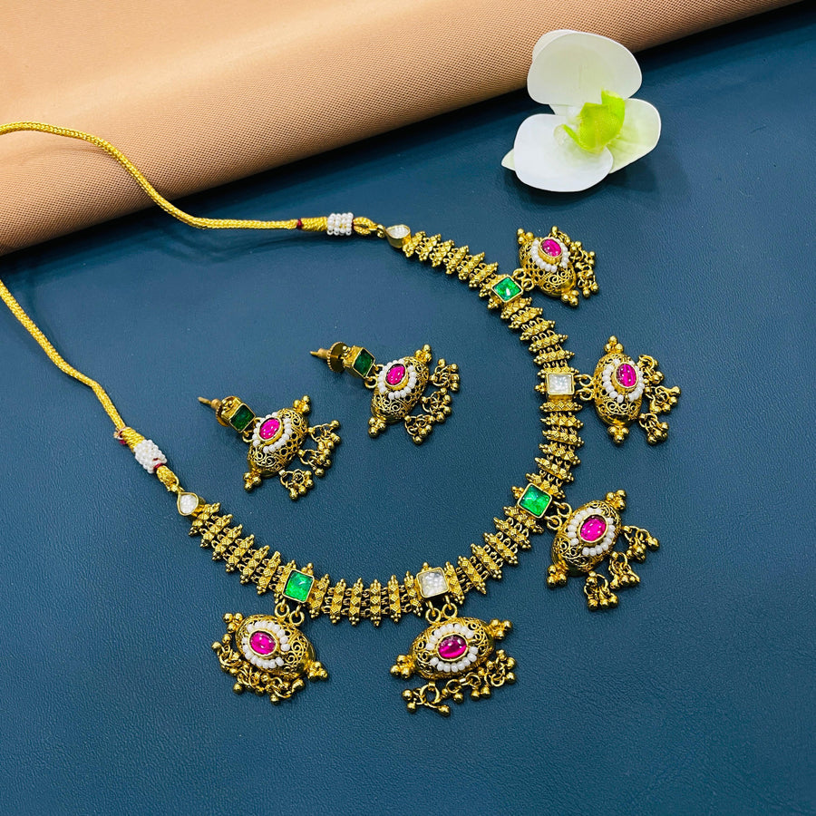 Stunning gold jewelry set featuring intricate designs for brides.