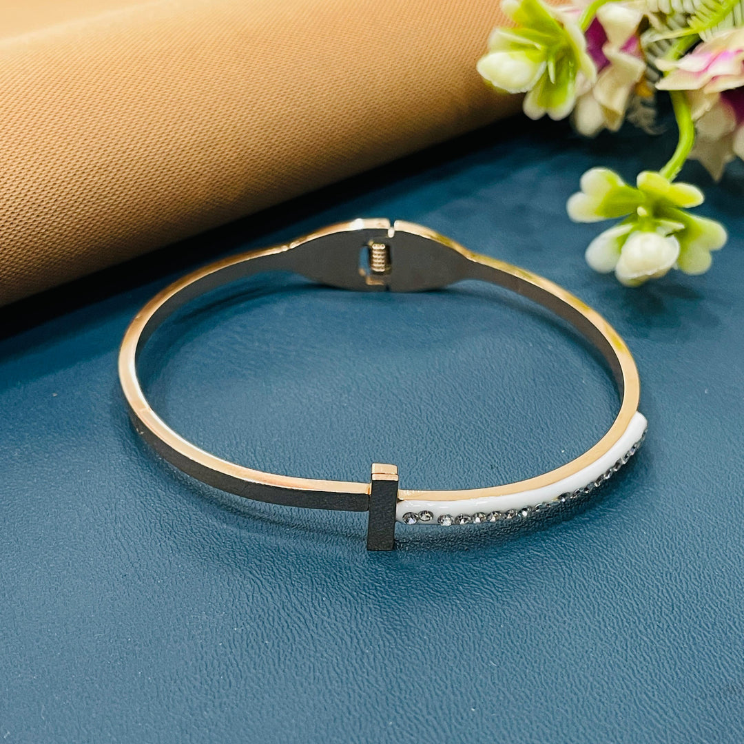 Dainty rose gold bracelet with a cubic zirconia stone, adding subtle sparkle.