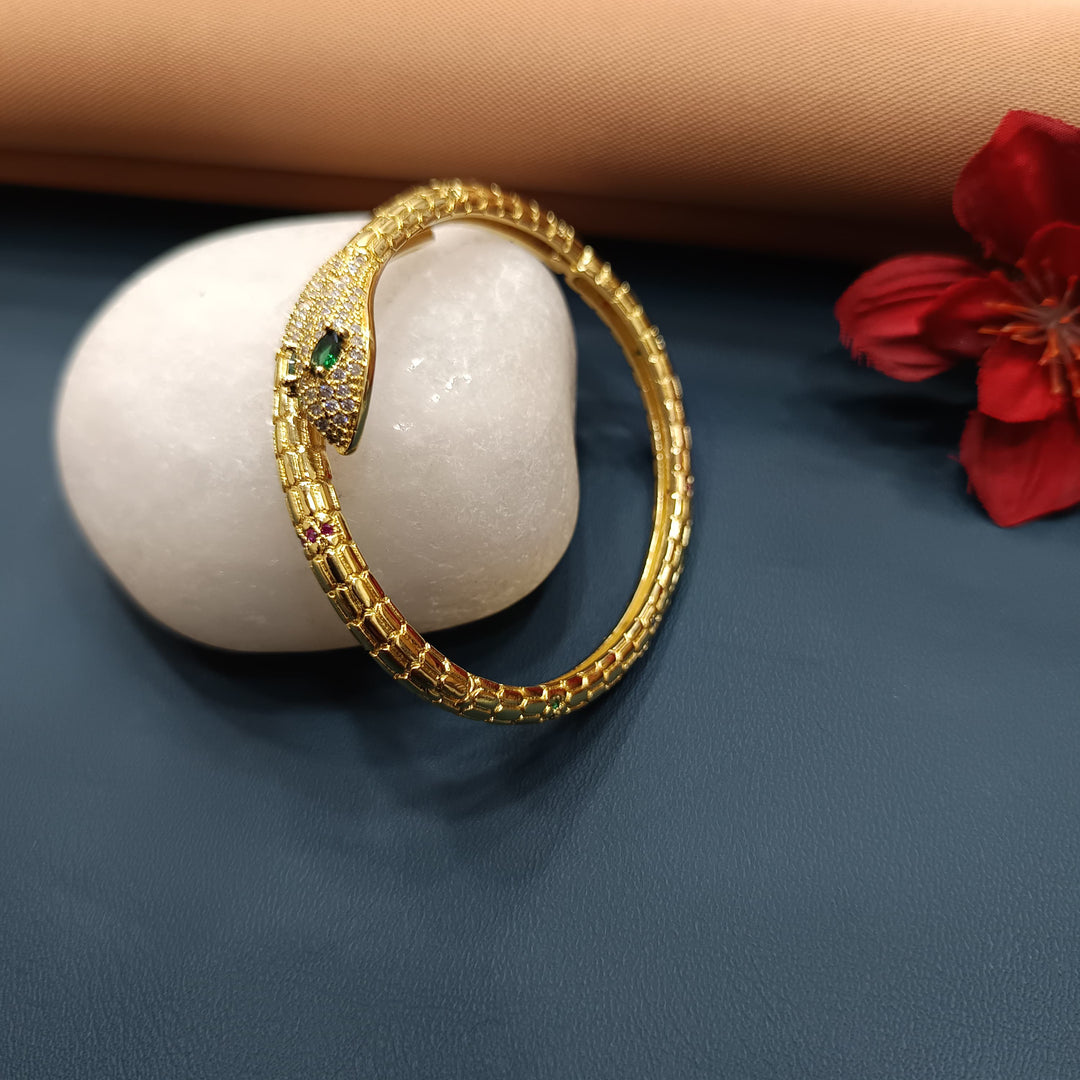 Charming golden bracelet featuring a single gemstone detail.