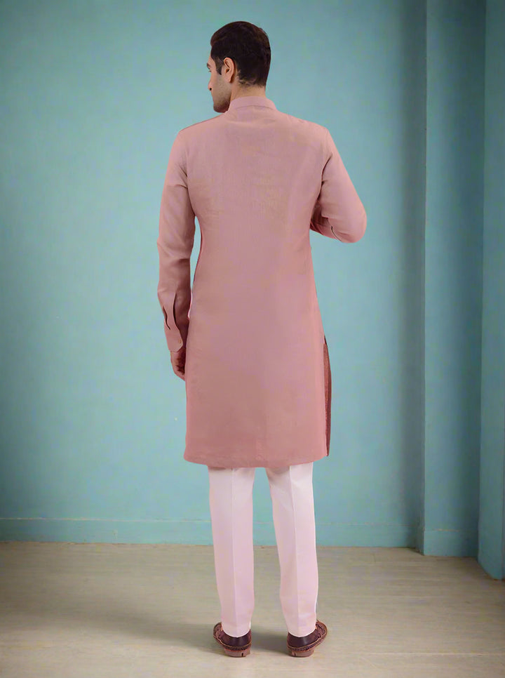 Casual onion pink kurta pajama set for men, crafted from linen for a comfortable fit.