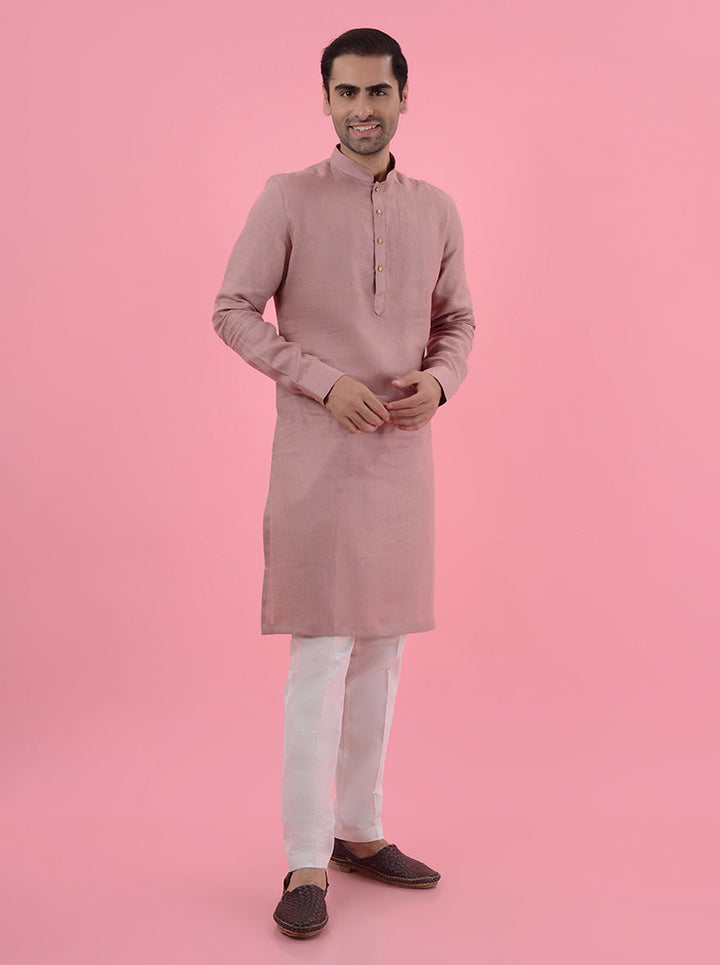 Make a statement in this onion pink kurta pajama, a must-have for fashionable men in the USA.