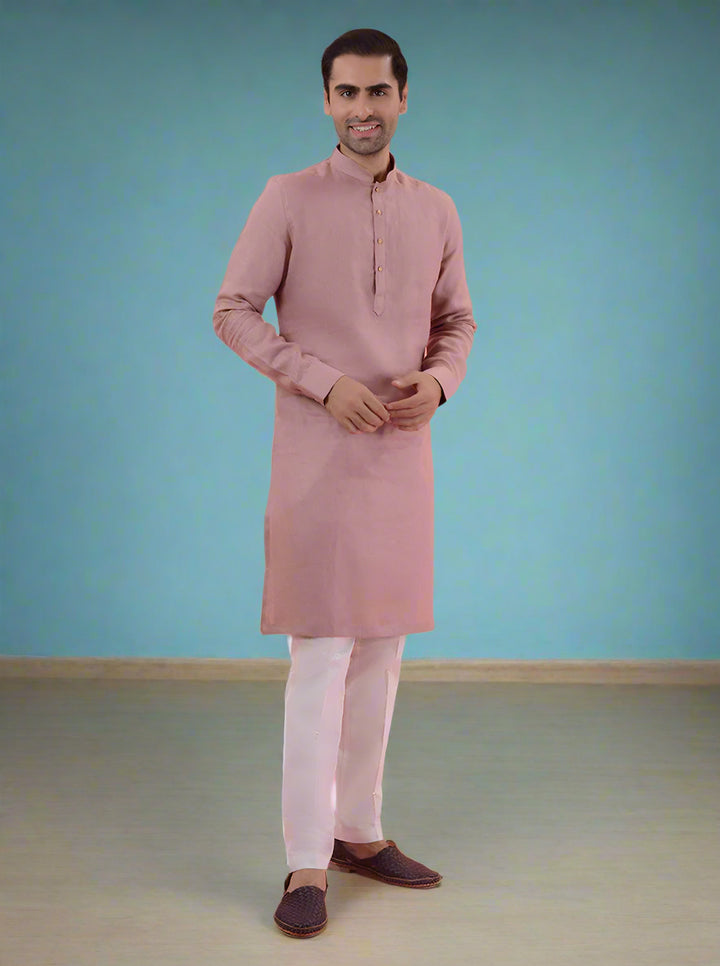 Stylish onion pink linen kurta for men, ideal for casual ethnic wear and family gatherings.