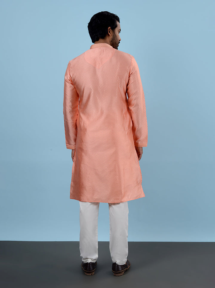 Make a statement at gatherings with this chic Peach Kurta Pajama tailored for modern men.