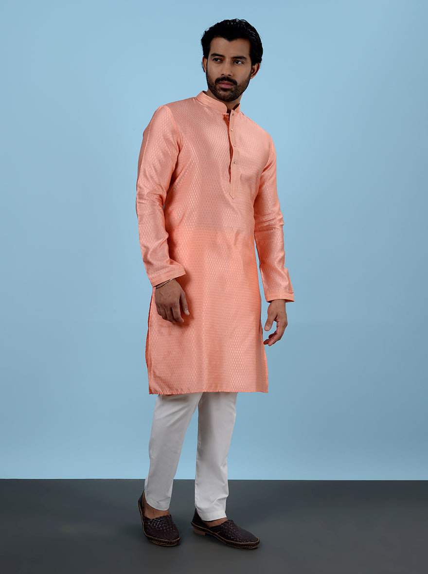 Experience the luxury of this stylish Peach Kurta Pajama, designed for festive moments.