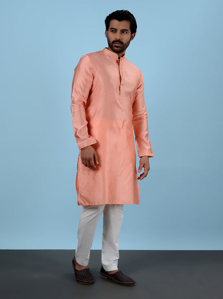 Experience the luxury of this stylish Peach Kurta Pajama, designed for festive moments.