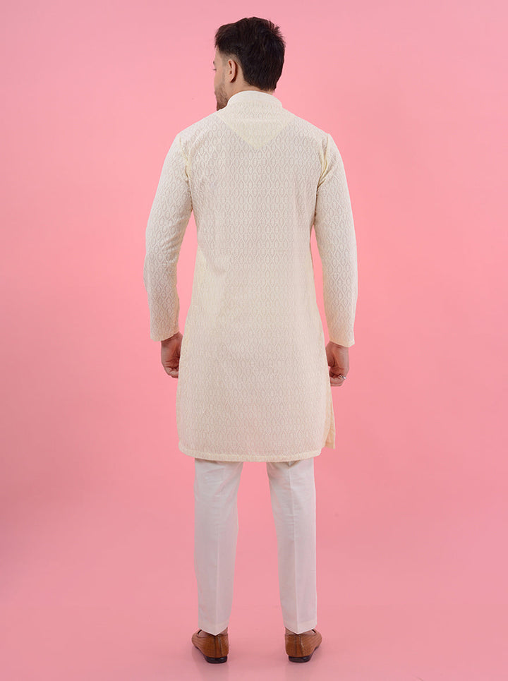 Shine at special occasions in the USA with this luxurious cream silk kurta pajama set for men.