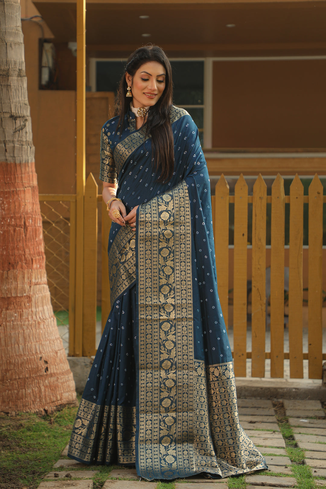 Stunning teal blue Bandhej Kanjivaram silk saree with intricate zari weaving and a rich pallu, perfect for bridal wear and special occasions.