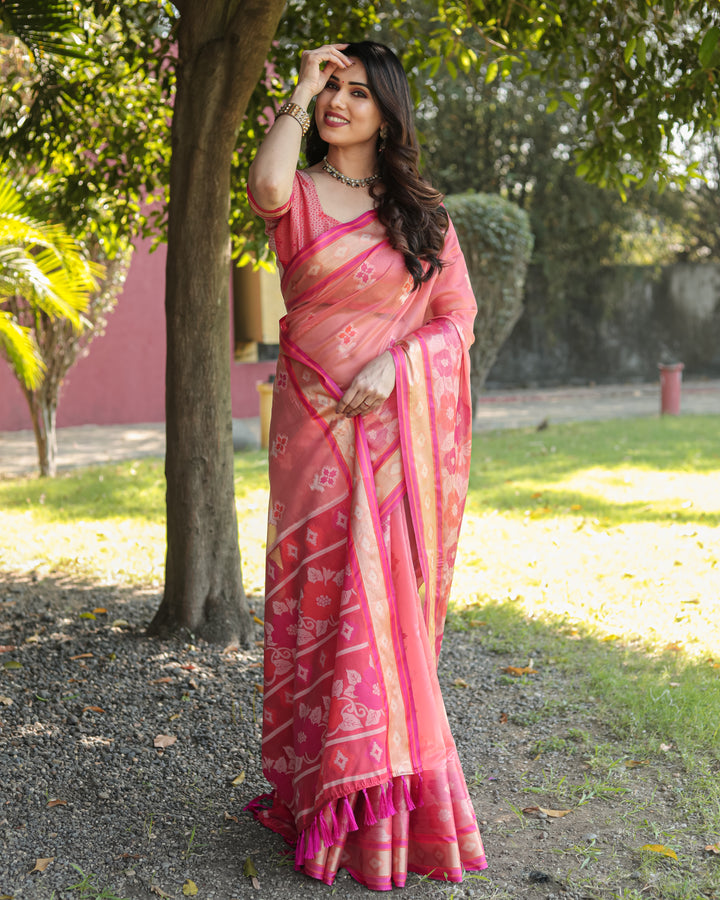 Pretty pink Ikkat weave Organza saree with tassels at the pallu, effortlessly combining style and comfort.