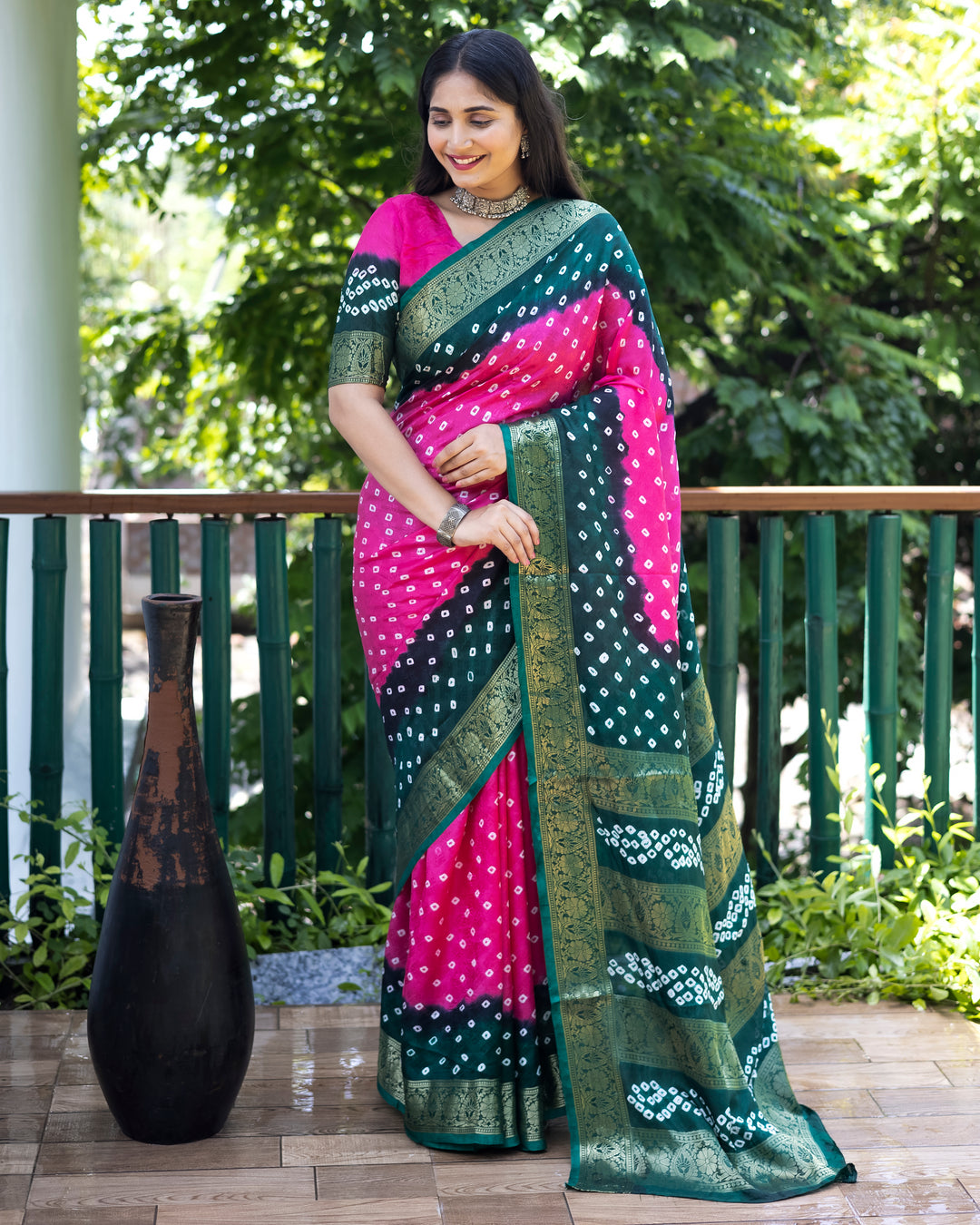 Elegant pink Bandhej silk saree with intricate zari embroidery and matching blouse, ideal for formal occasions.