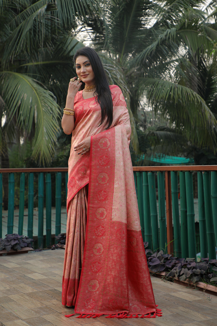 Radiant peach silk saree with stunning Kanjivaram work and a delicate shine, making it a must-have for festive seasons.