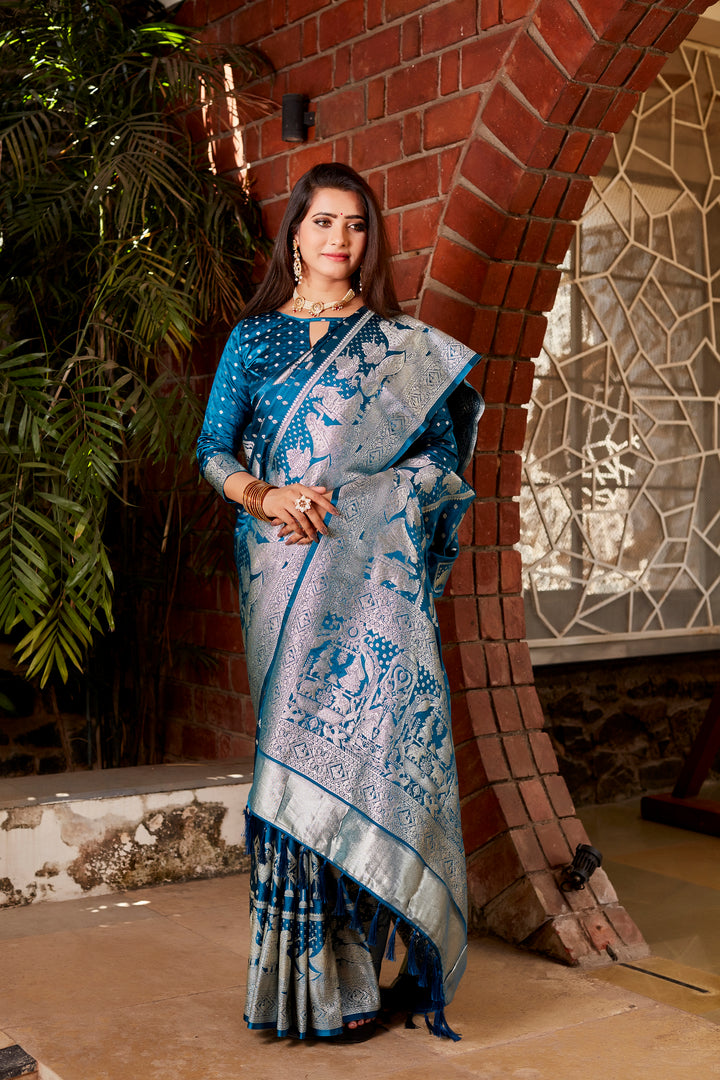 Elegant blue soft satin silk saree with intricate weaving and a stunning designer border, ideal for weddings and cultural celebrations.