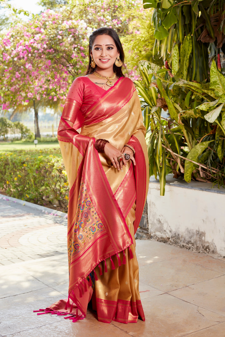 Graceful beige tissue silk saree with rich pallu and matching contrast blouse, ideal for cultural events.