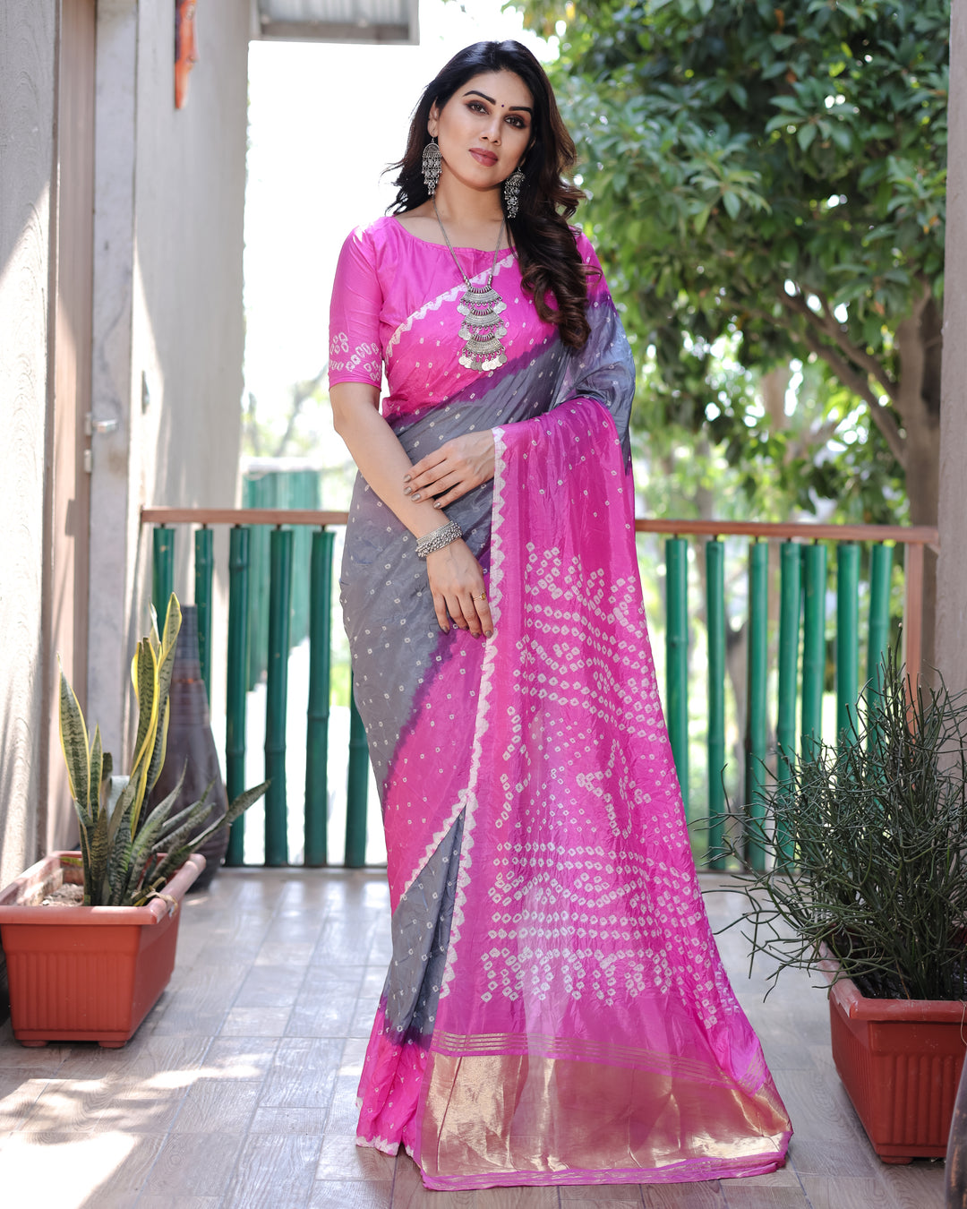 Hot-Pink Premium Bandhej Silk Drapes featuring intricate Zari Tissue Pallu and blouse piece for festive wear.