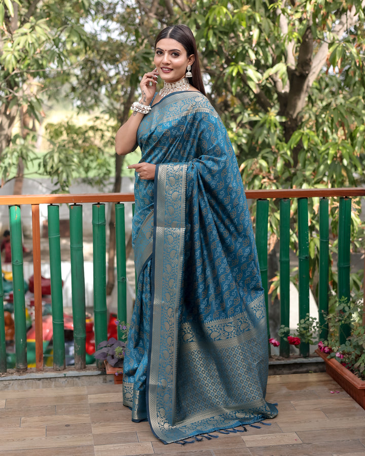 Beautiful maroon Bandhej Patola saree with rich zari work and regal Kanchi borders, perfect for grand events.