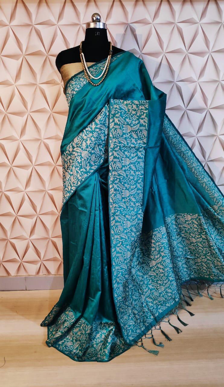 Elegant sea blue raw silk saree with intricate pallu weaving, ideal for traditional Indian ceremonies.