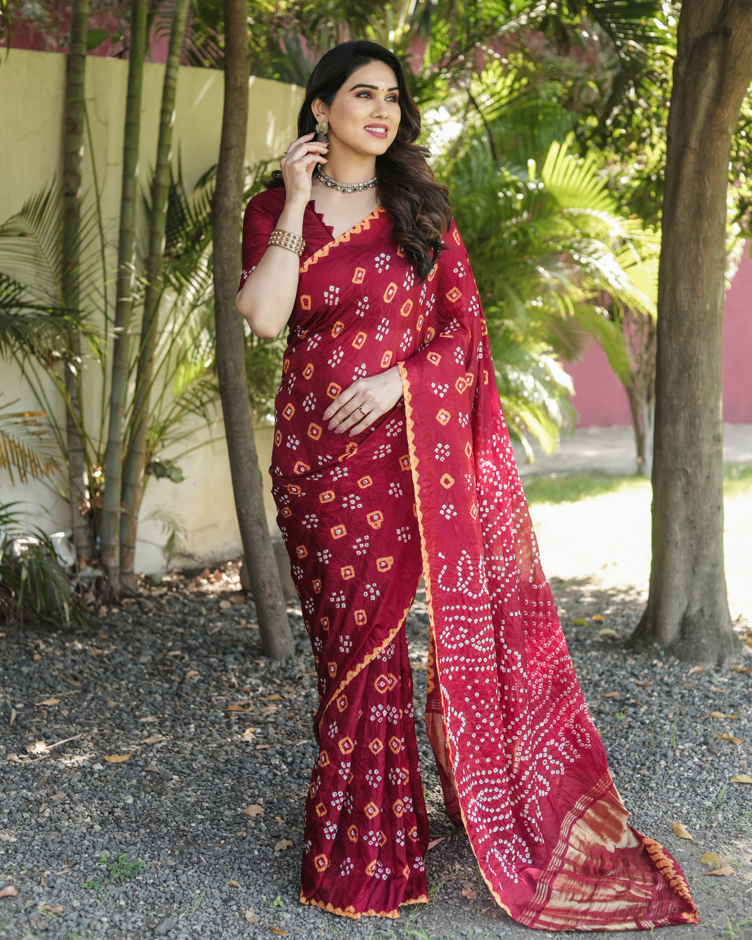 Stylish Bandhej silk saree with intricate zari work and luxurious tissue pallu.