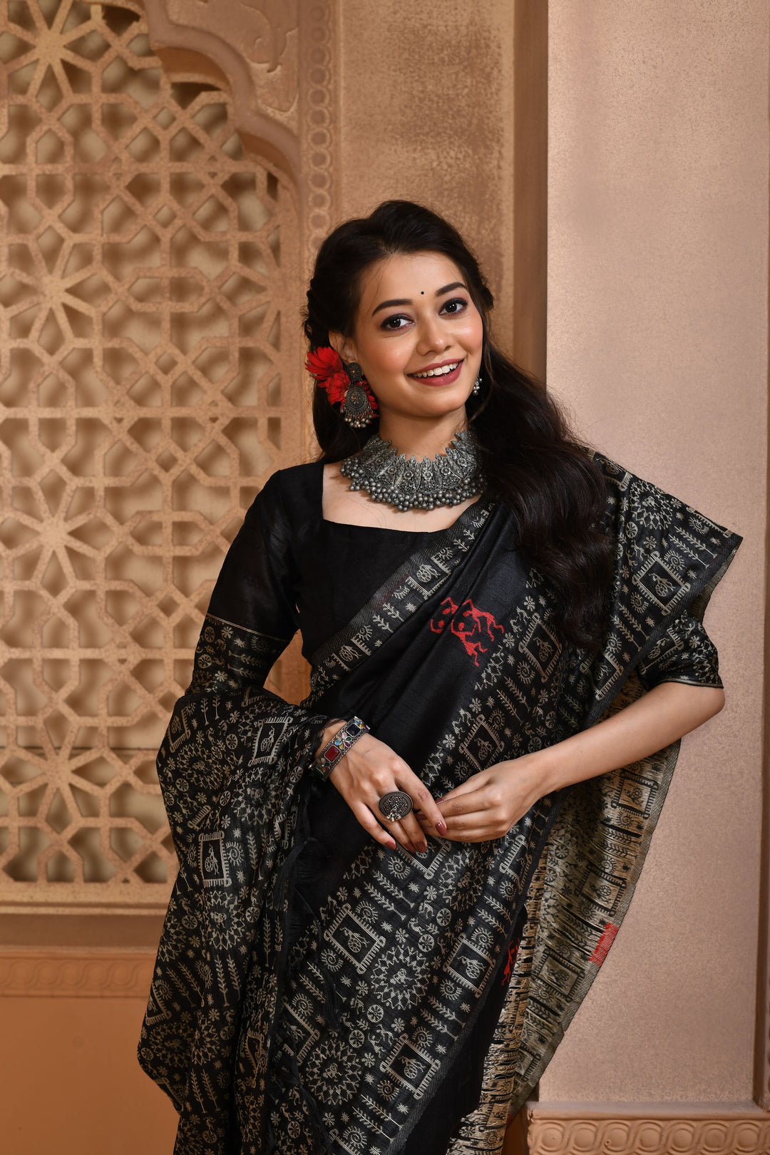 Timeless black handloom raw silk saree with detailed weaving pallu, ideal for cultural celebrations.