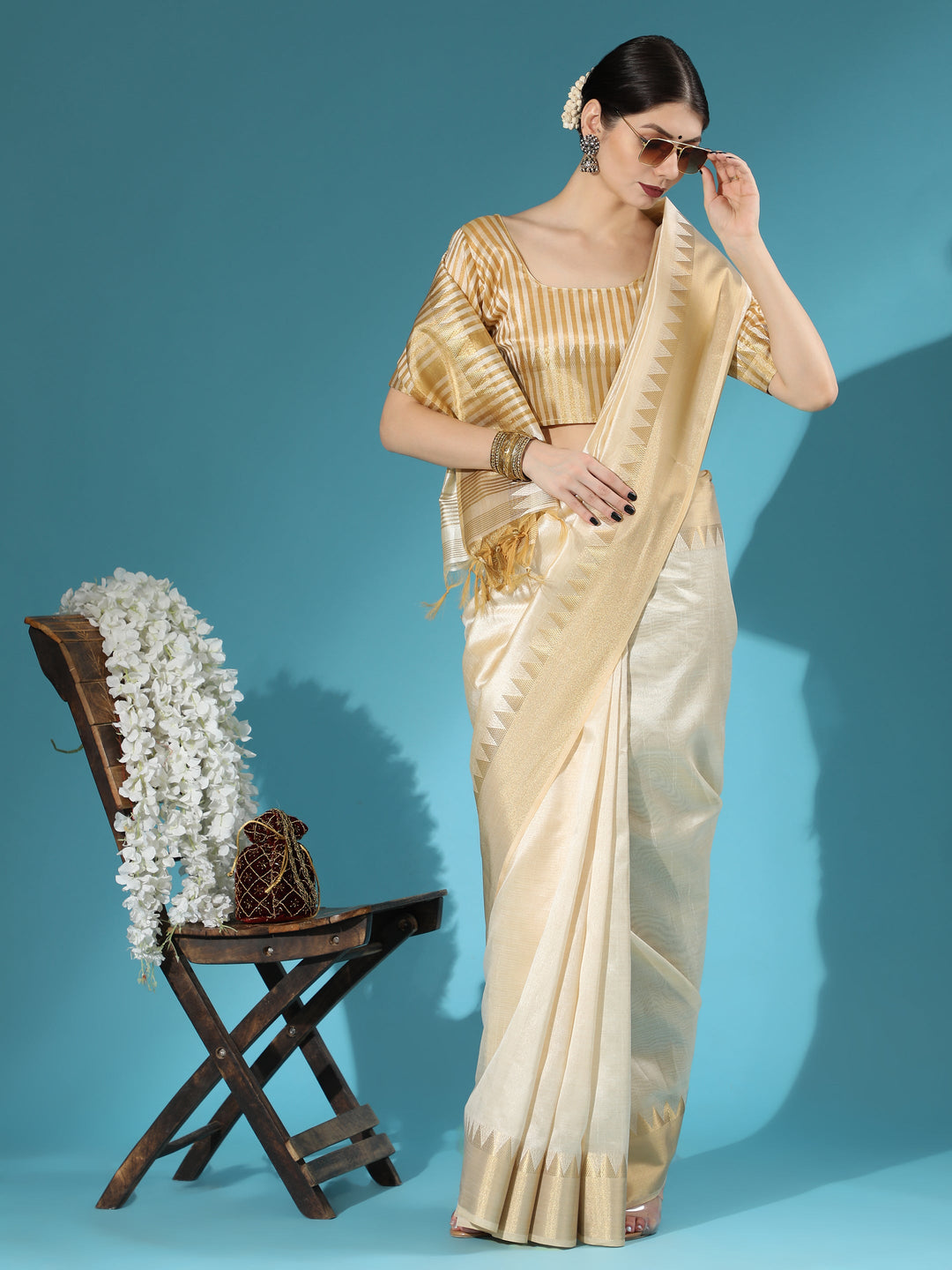 Designer cream saree with exquisite zari temple border and pallu, perfect for any special occasion or Indian wedding.