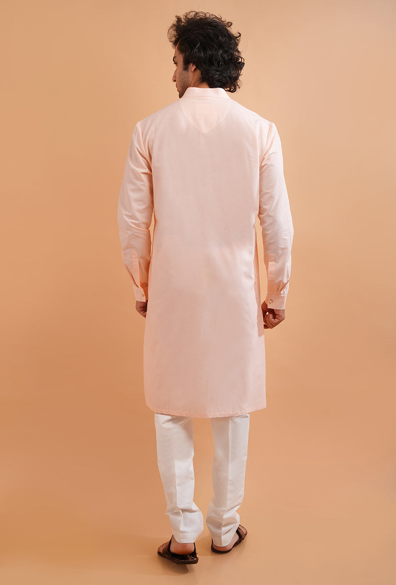 Men’s embroidered pink kurta pajama, designed with a cotton blend for comfortable wear.