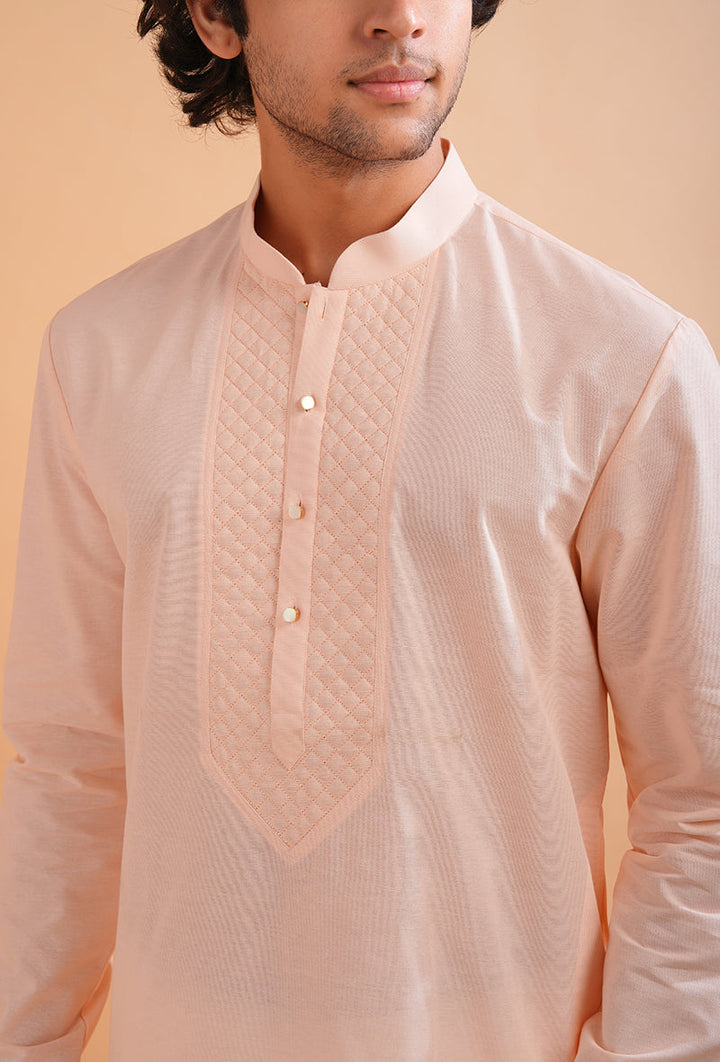 Comfortable pink cotton kurta pajama for men, ideal for daily wear and cultural gatherings.