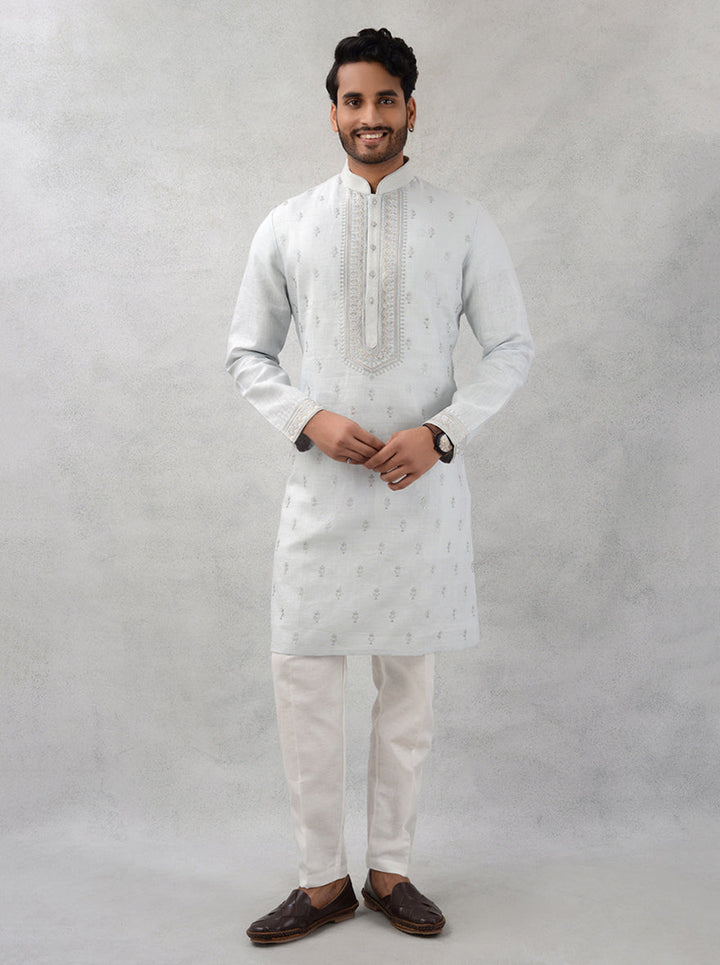 Unique light grey kurta pajama with exquisite embroidery details.