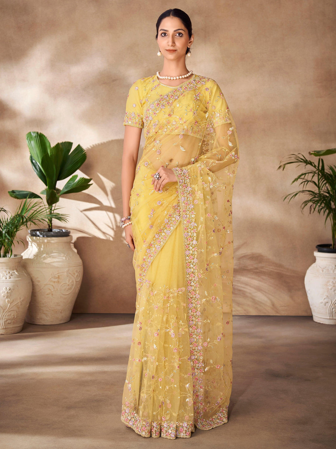 Yellow luxurious fabric saree crafted for elegance and style.