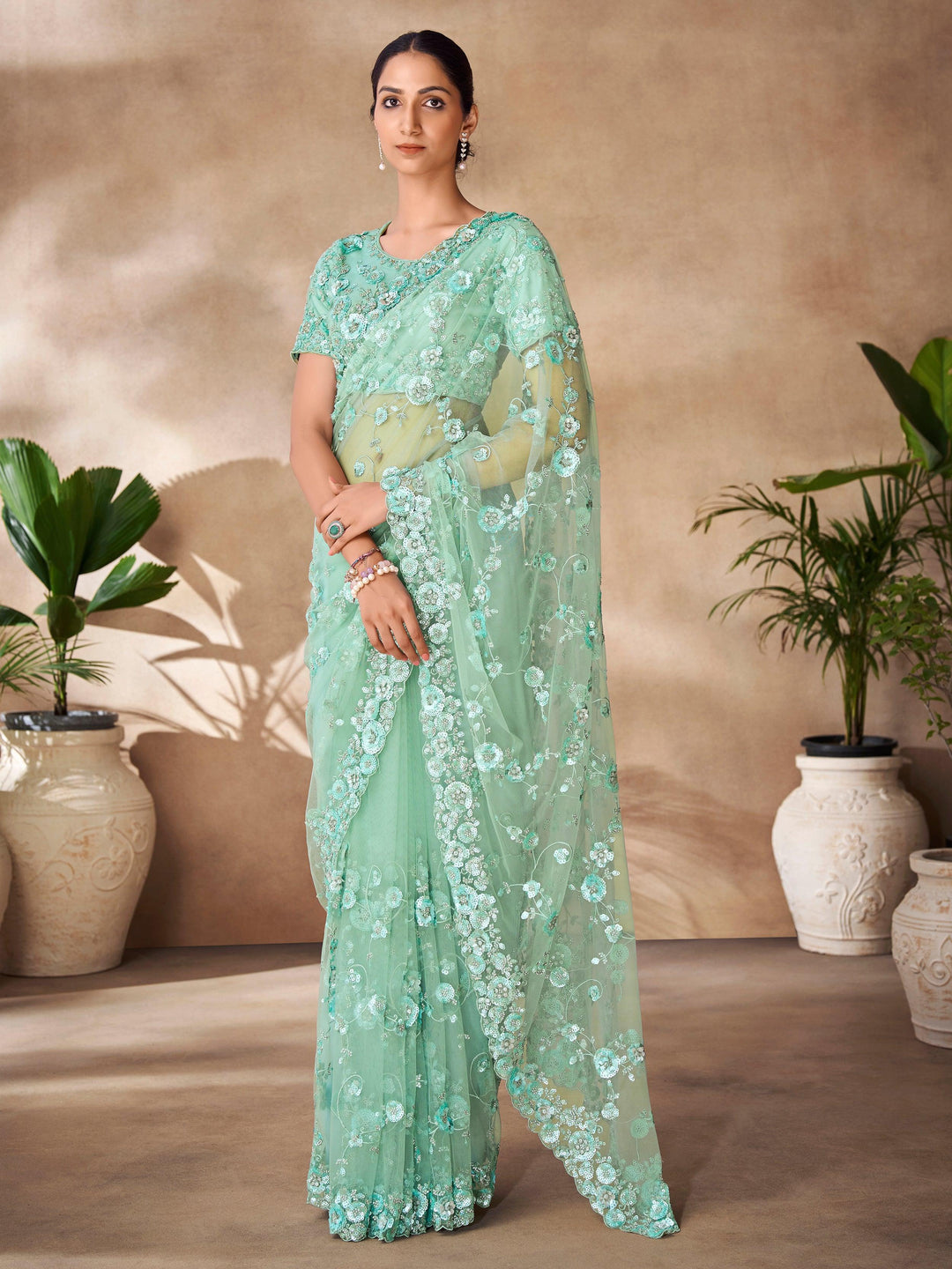 Green luxurious fabric saree crafted for elegance and style.