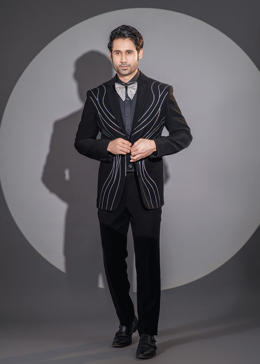 Black tuxedo set for men with stardust-inspired asymmetrical design and Dana work, ideal for special formal occasions.