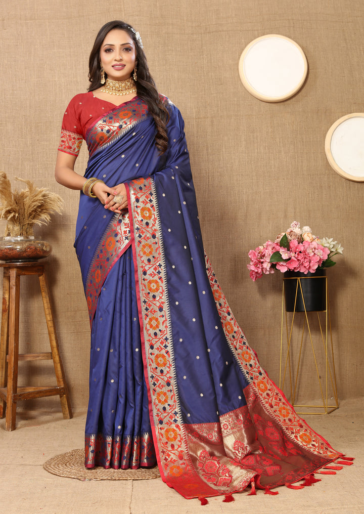 Regal navy blue Paithani silk saree with Meenakari weaving and a stunning zari pallu.