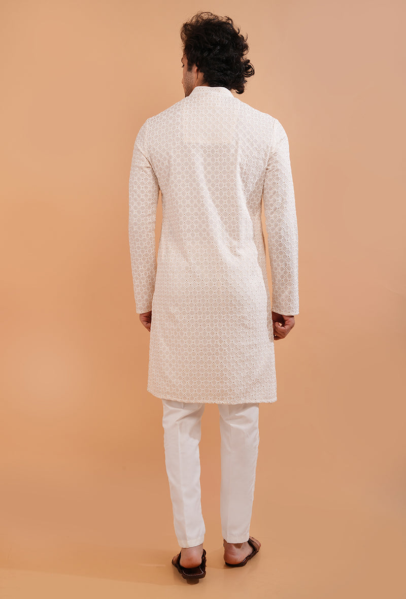 Men’s cream embroidered kurta pajama set, designed for elegant festive wear.