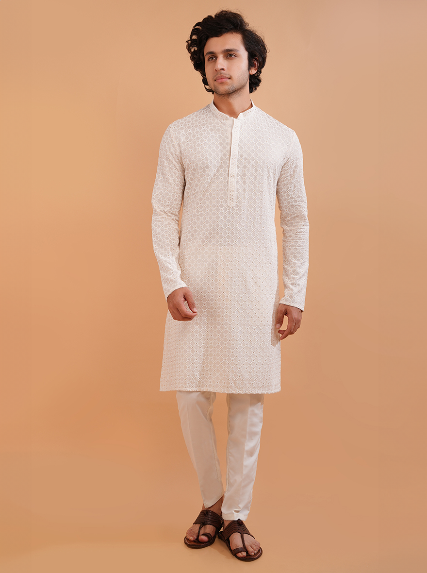 Men’s cream silk blend kurta pajama set, perfect for weddings and cultural celebrations.