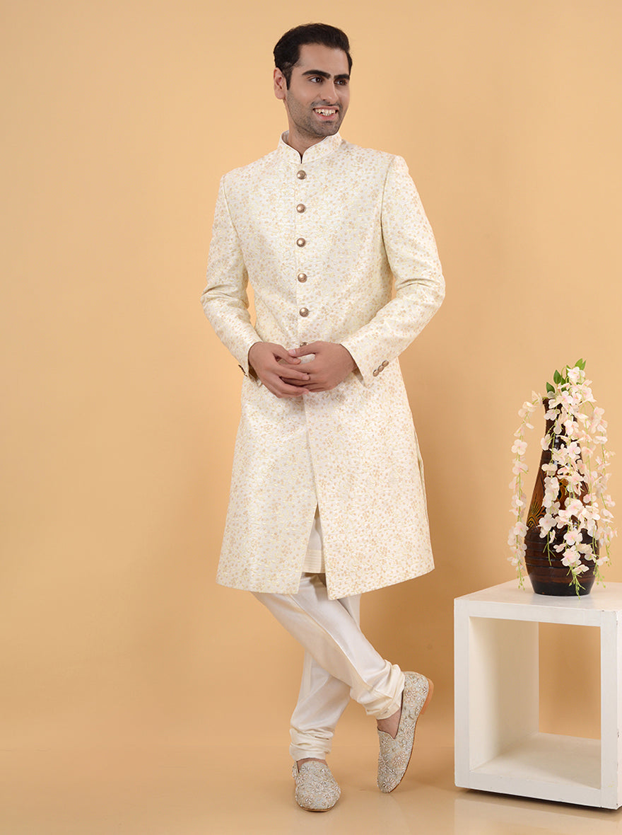 Step into elegance with this Off White Silk Blend Sherwani, designed with intricate embroidery, ensuring you stand out at weddings in the USA as a modern groom.