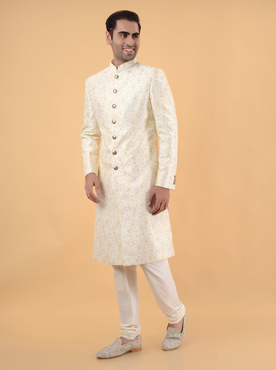 This Off White Silk Blend Sherwani combines classic design with intricate embroidery, making it an essential piece for grooms celebrating their special day in the USA.