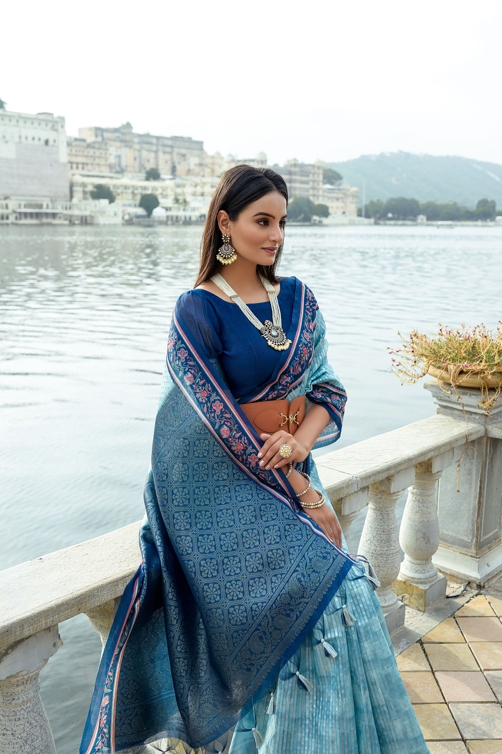 Elegant silk saree with all-over zari weaving and flower-printed border