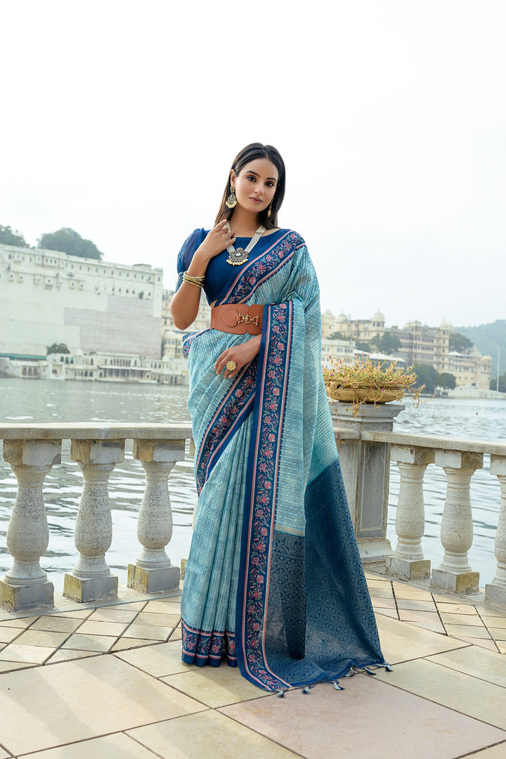 Soft silk saree with flower-printed contrast border and rich zari pallu