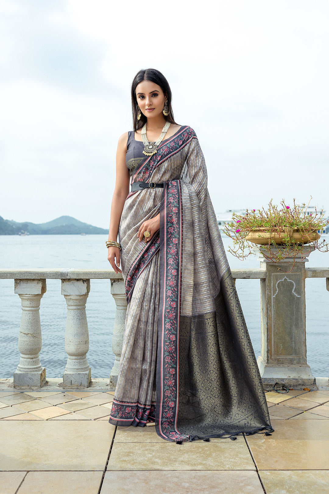 Soft silk saree with intricate zari weaving and contrast floral border