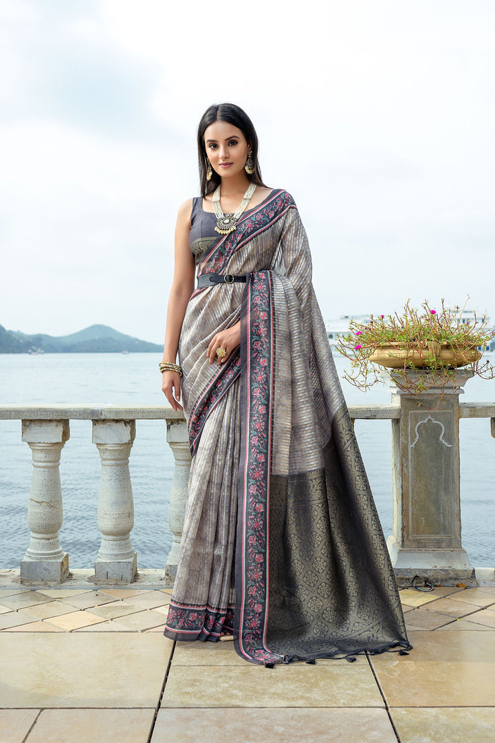 Soft silk saree with intricate zari weaving and contrast floral border