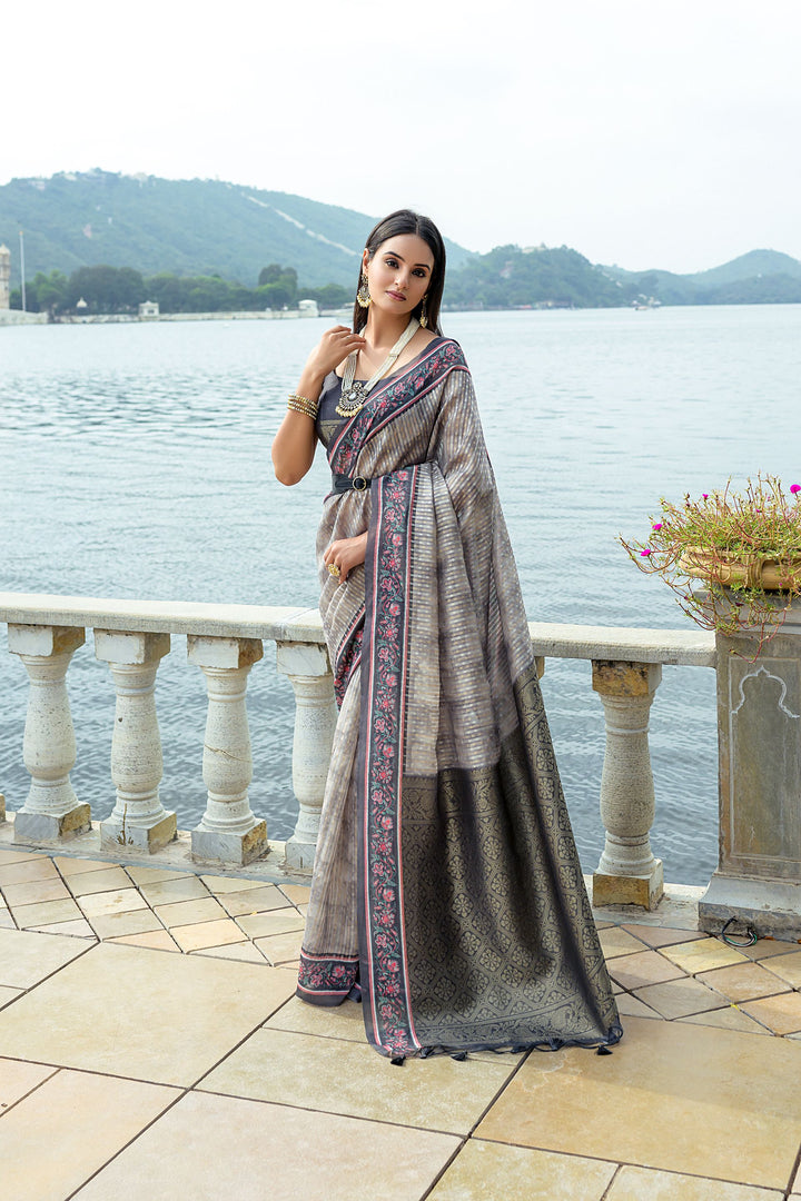 Traditional silk saree with rich zari pallu and flower-printed contrast border