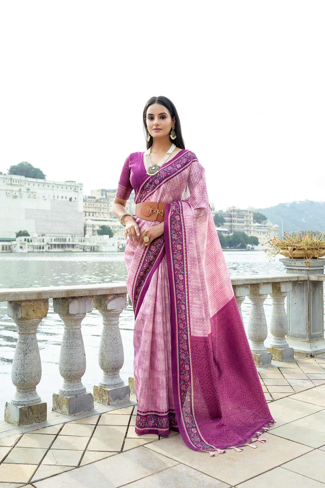 Traditional silk saree with rich zari weaving and floral contrast border