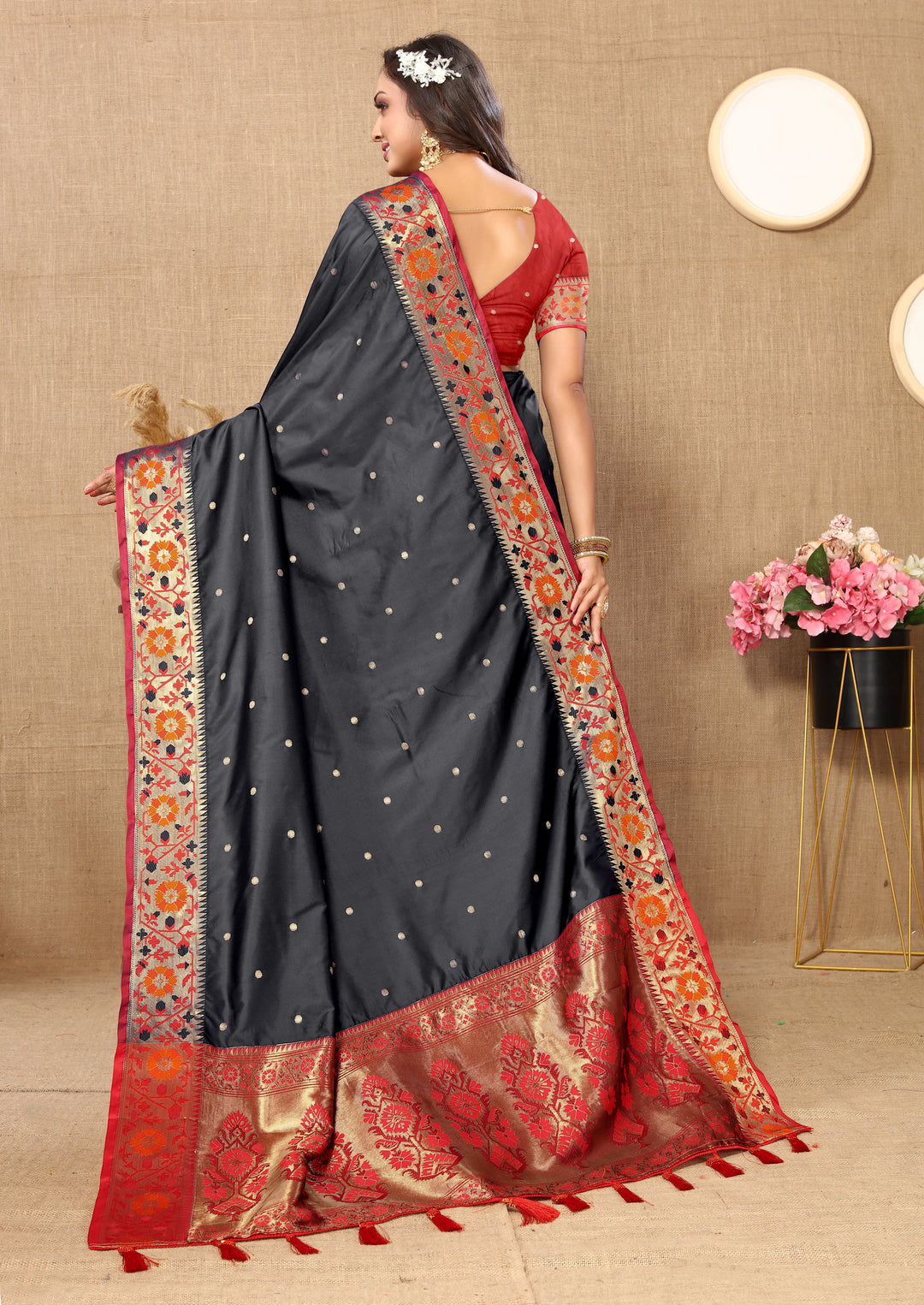 Sleek black Paithani silk saree with stunning Meenakari weaving and a glittering zari pallu.