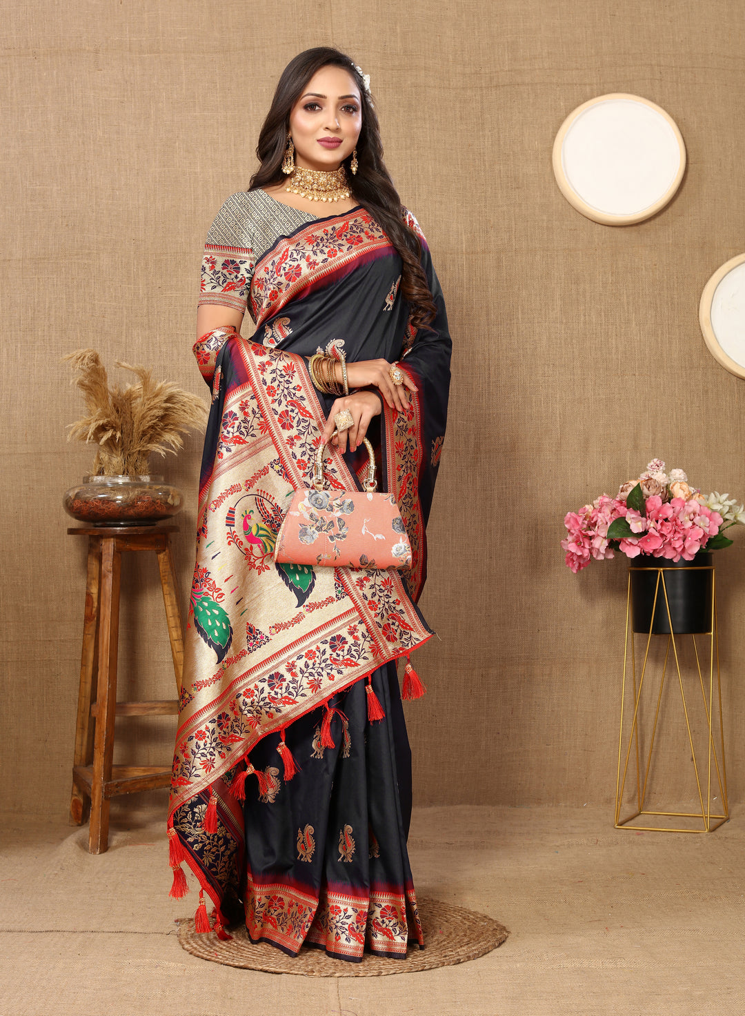 Designer black Paithani silk saree with zari pallu and tassels, ideal for formal events.