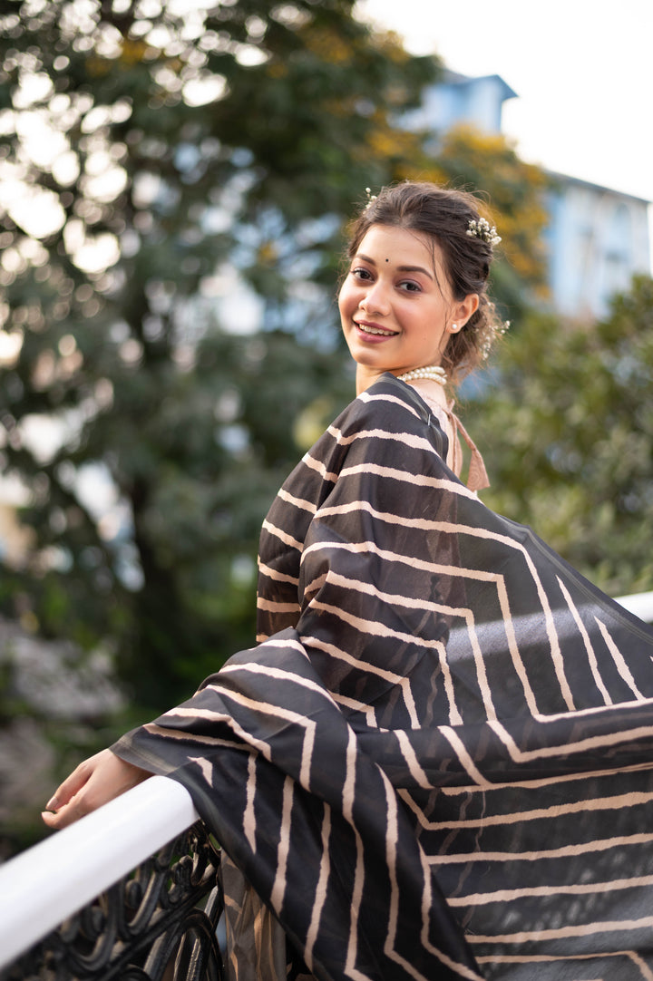 Tussar silk saree with Kalamkari-style pallu and intricate zari border